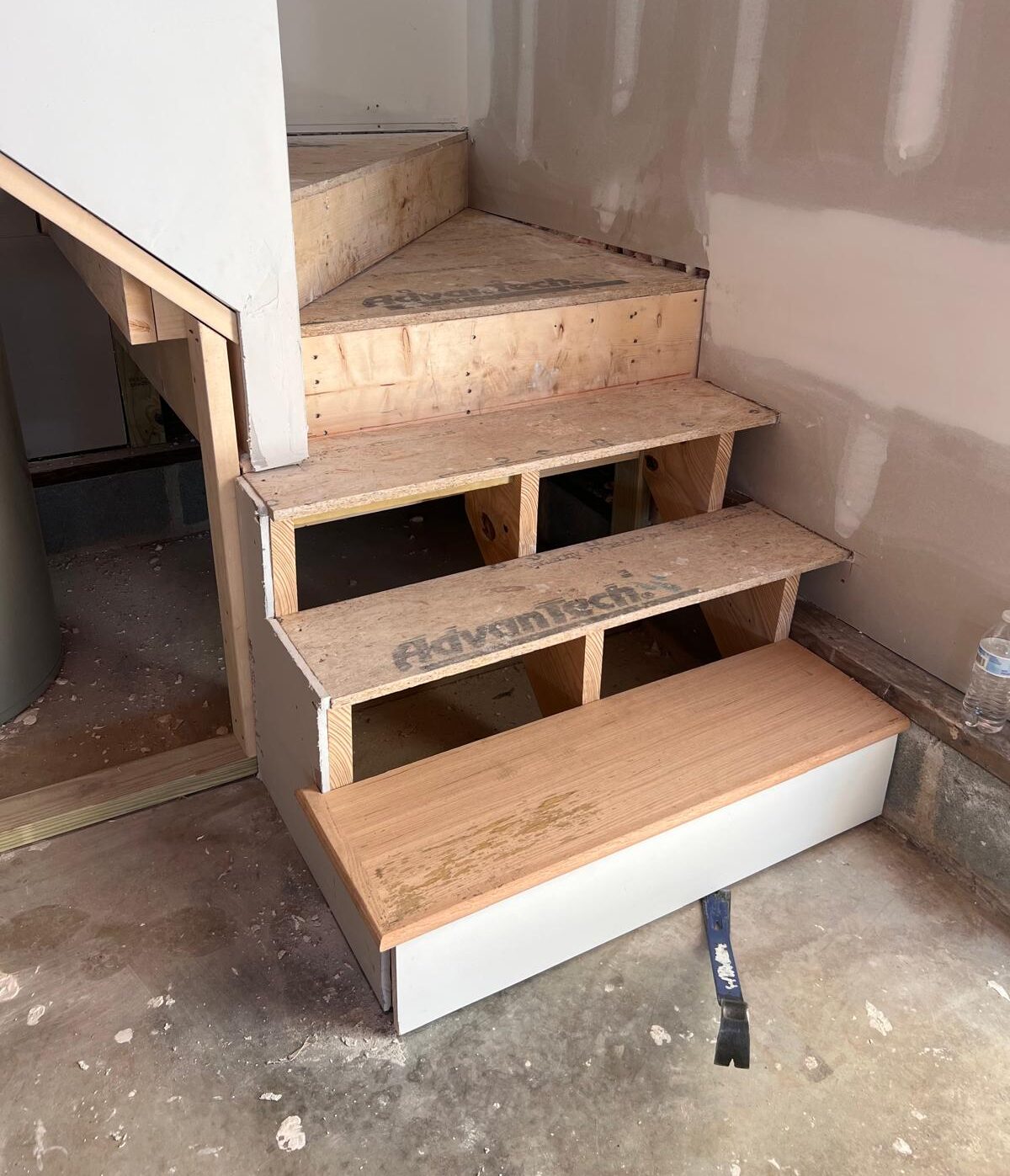 Stairs before flooring Morales Flooring nc installation raleigh nc Hardwood floor installation before and after - kitchen remodel by Morales Flooring Raleigh NC